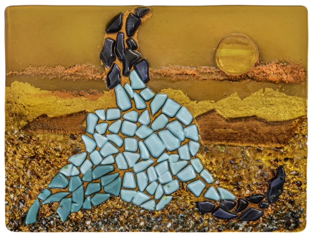 Fused glass artwork of a seated figure in turquoise mosaic glass
